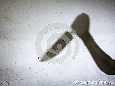 Male Hand Shadow with Kitchen Knife, Stock Photo