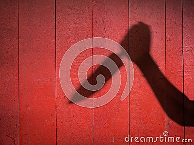 Male Hand Shadow with Kitchen Knife Stock Photo