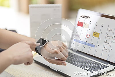 Male hand with smart watch on wrist. Planning agenda and schedule using calendar event planner. Calender planner, relax time Stock Photo