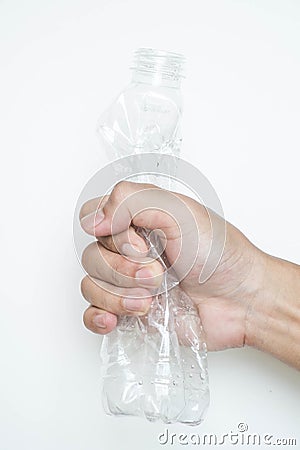 Male hand squeeze plastic bottle Stock Photo