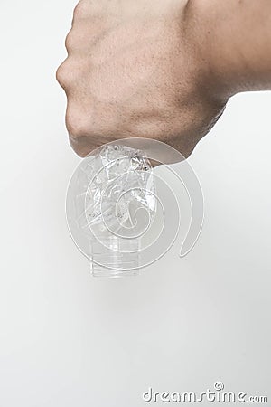 Male hand squeeze and pour down plastic bottle Stock Photo