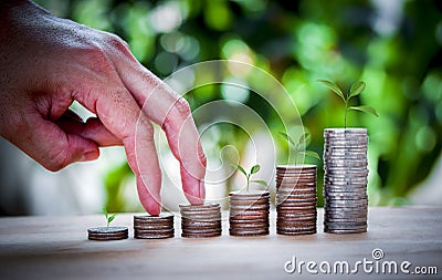 Male hand stack coins same stair for the first step for the future Stock Photo