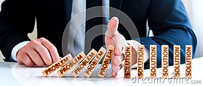 the male hand stops the blocks with the inscription problem and builds blocks with a solution to it. Stock Photo