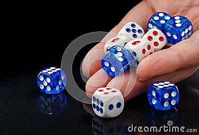 The male hand throwing dices on dark background Stock Photo