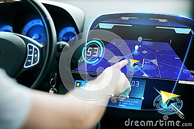 Male hand using navigation system on car dashboard Stock Photo