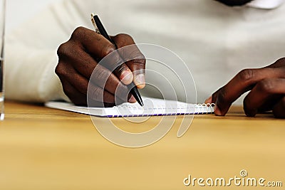 Male hand writing on a paper Stock Photo