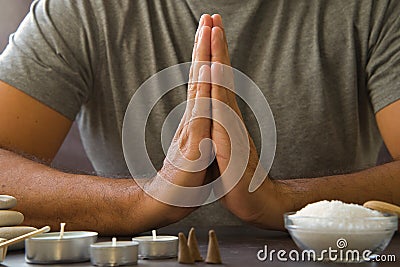 Male hands in an attitude of gratitude or prayer. Relaxed atmosphere for the practice of meditation or yoga Stock Photo