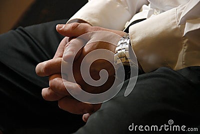 Male hands of a businessman in a castle on his knees. Waiting for a meeting, recruitment, recruiting, job seeker. Business concept Stock Photo