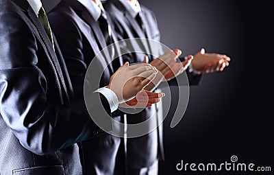 Male hands clapping on black Stock Photo