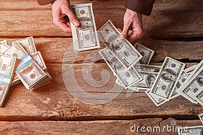 Male hands counting dollars. Stock Photo