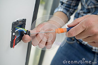 Male hands doing electrics Stock Photo