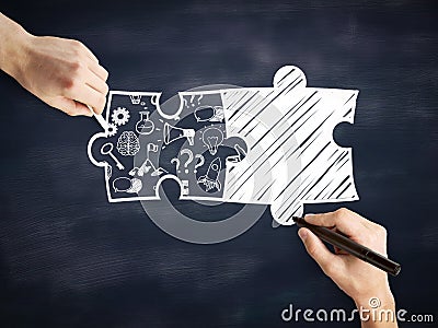 Male hands drawing puzzle pieces Stock Photo