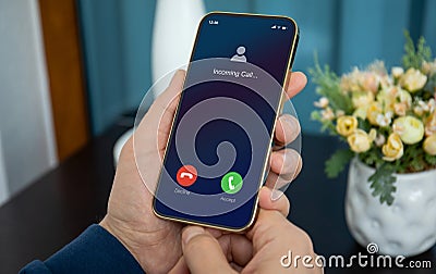 male hands holding phone with incoming call on screen Stock Photo