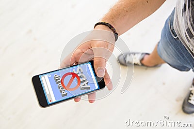 male hands pop up ads blocker smartphone Stock Photo