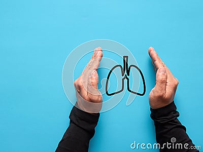 Male hands protecting the lung symbol. Health care and insurance Stock Photo