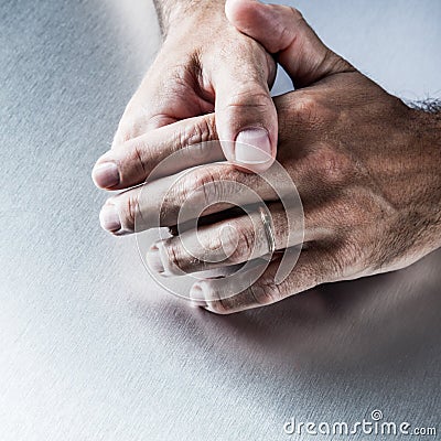 Male hands showing proof of engagement in displaying wedding ring Stock Photo