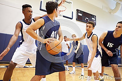 Male High School Basketball Team Playing Game Stock Photo