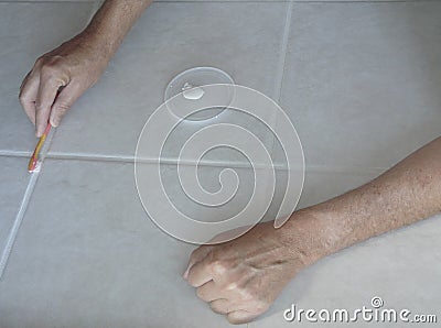 Painting and Sealing Tile Grout Lines Stock Photo