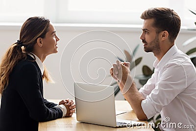 Male hr employer talk to female applicant at job interview Stock Photo