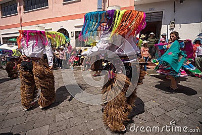 Male indigenous dancers in chaps in Ecuador Editorial Stock Photo