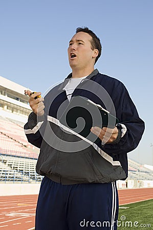 Male Instructor On Racing Track Stock Photo