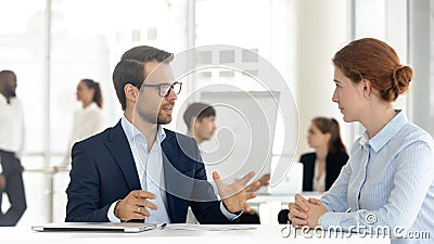 Male insurance broker or bank manager consulting client making offer Stock Photo