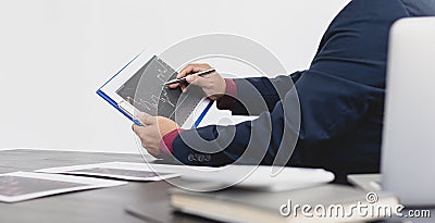 Male investment businessman has analyzed the market of the stock graph and evaluated the financial risks with the Business Intelli Stock Photo