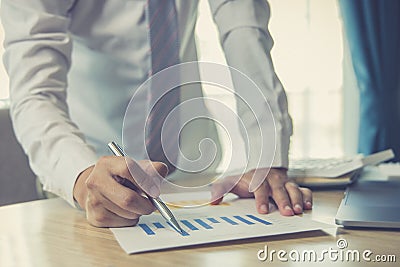 Male investment businessman has analyzed the market of the stock graph and evaluated the financial risks with the Business Intelli Stock Photo