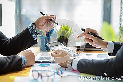 Male investment consultant calculate the project expenses Stock Photo