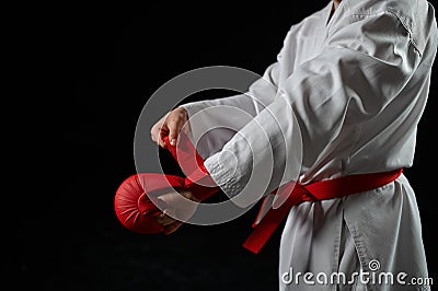 Male karate fighter having red belt and gloves Stock Photo