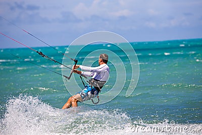 Male Kitesurfer turning hard Stock Photo