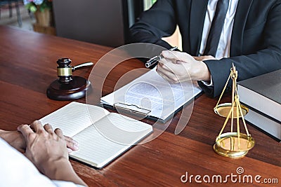 Male lawyer discussing negotiation legal case with client meeting with document contact in courtroom, law and justice concept Stock Photo