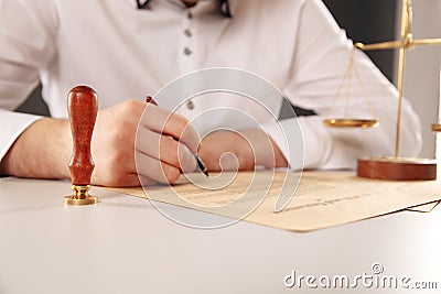 Male lawyer working with contract papers. Stock Photo