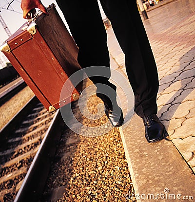 Male legs and suitcase Stock Photo