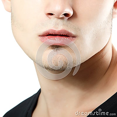 Male lips, chin and cheekbone coseup, face detail of young man Stock Photo