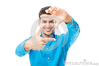 Male Making Hand Frame And Aspiring To Be A Director Stock Photo