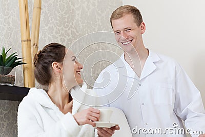Male masseur talking to his female patient Stock Photo