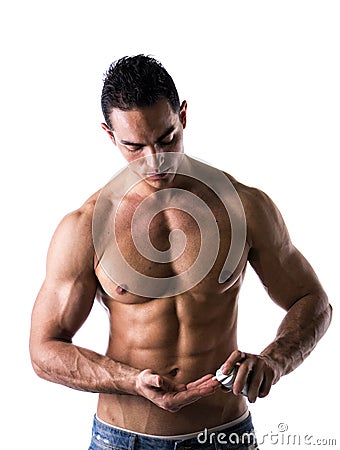 Male model putting cream in his hand Stock Photo
