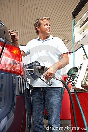 Male Motorist Filling Car With Petrol Stock Photo