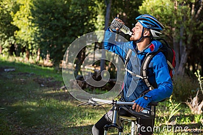 Male mountain biker drinking water Stock Photo