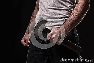 Male offender with a big hammer. On black background at the studio Stock Photo