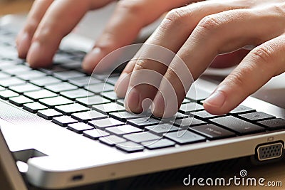 Male office worker typing on keyboard Stock Photo