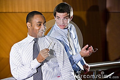 Male office workers conversing Stock Photo