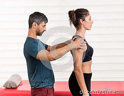 Male osteopath doing a postural evaluation Stock Photo