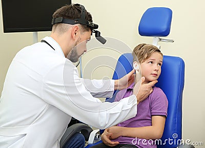 Male otolaryngologist examining little child Stock Photo