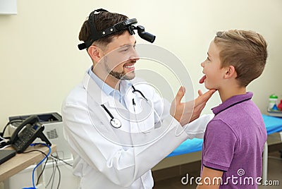 Male otolaryngologist examining little child Stock Photo