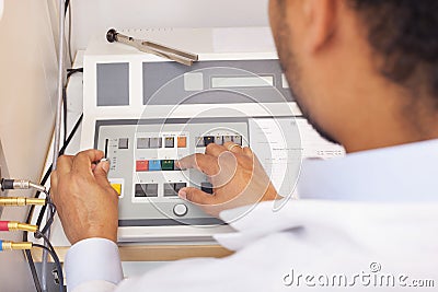 Male otolaryngologist on hearing test machine Stock Photo