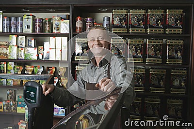 Male Owner Standing In Shop Stock Photo