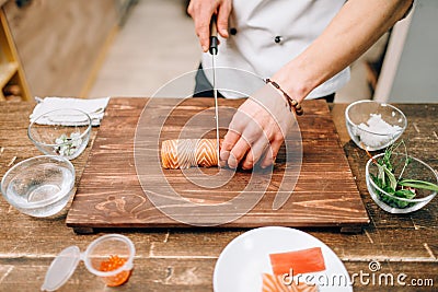Male person cooking seafood, japanese food Stock Photo