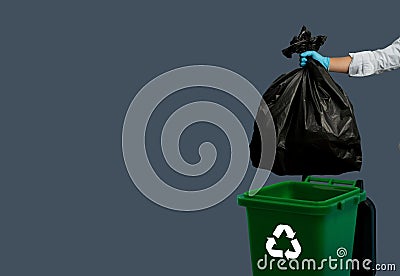 male person hand holding garbage black to bin trash full junk plastic at home environmental bio clean concept Stock Photo